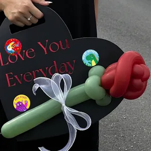 Close-up of colorful cartoon reward stickers with encouraging English phrases on PVC