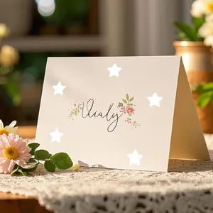 Detail view of white pentagram reward stickers on a floral greeting card background