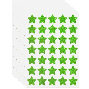 Detail of green glitter star stickers for children rewards and crafts decoration.