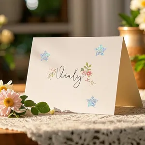 Detailed macro view of sparkling holographic star stickers applied on an elegant card