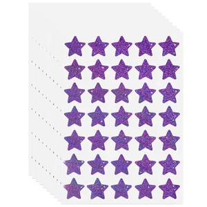 Close-up detail of purple glitter star reward stickers with a shimmering holographic finish