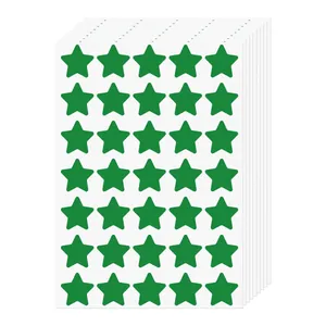 Stack of white sheets featuring rows of small green star reward stickers