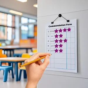 Detail of purple star reward stickers on a student commendation chart for kids