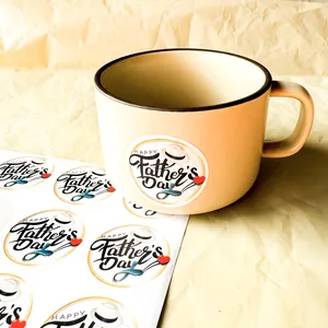 Detailed view of 1.5 inch Happy Father's Day stickers on a beige mug and sticker sheet