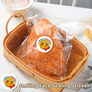 Close-up of a cute yellow smiling face sticker used for sealing a bread pastry bag
