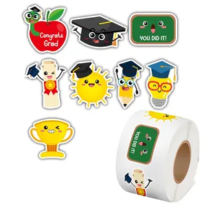 Detail of graduation reward stickers on a roll featuring cartoon trophy and apple designs