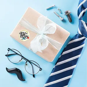 Detailed view of Father's Day sticker on a gift box with a tie and glasses