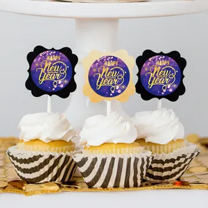 Close-up of Happy New Year round labels used as decorative toppers on white cupcakes