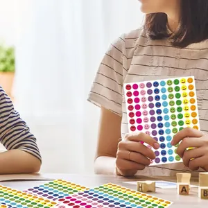 Close-up of colorful smiley face reward sticker sheets used for encouraging students and kids