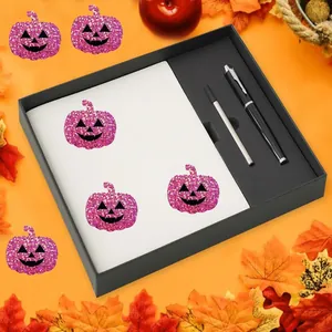 Detailed view of pink glitter Halloween pumpkin stickers in a black gift box set