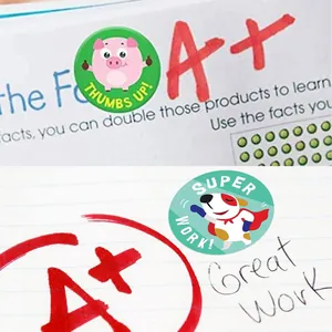 Close-up of colorful cartoon animal reward stickers used for teacher encouragement on schoolwork.