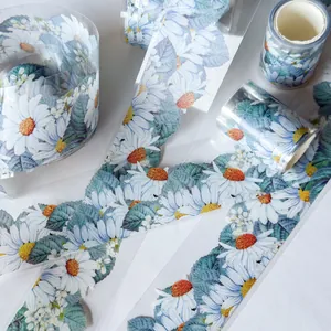 Detailed view of transparent PET tape featuring vibrant daisy and leaf patterns.