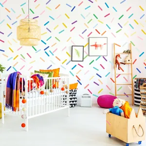 Vibrant colorful Macaron confetti wall decals applied to a white nursery room wall