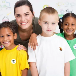 Children dinosaur reward stickers shown as decorative labels on colorful t-shirts.