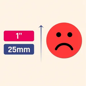 Detail view of 1 inch red sad face emotion sticker with 25mm size markings