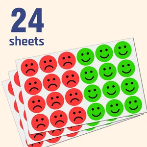 Detail showing twenty-four sheets of red sad and green happy face emotion reward stickers