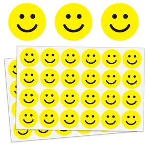 Bright yellow round smiley face stickers for kids reward and DIY decoration.