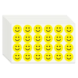 Close-up of vibrant yellow smiley face reward stickers sheets for kids decoration tasks