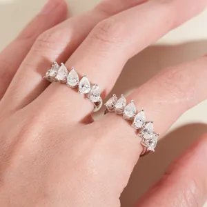 Elegant detailed view of S925 silver rings with pear-cut moissanite stones on a hand