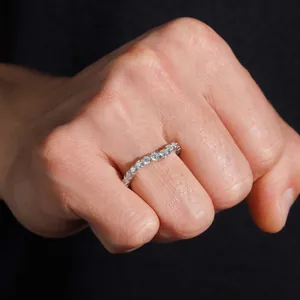 Detailed macro shot of an S925 sterling silver eternity ring set with moissanite