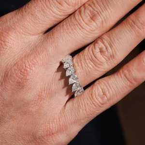 Close-up of S925 silver ring featuring five sparkling pear-cut moissanite stones.
