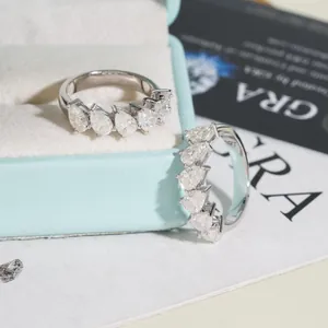 Luxury S925 sterling silver half-eternity ring featuring pear-cut Moissanite stones