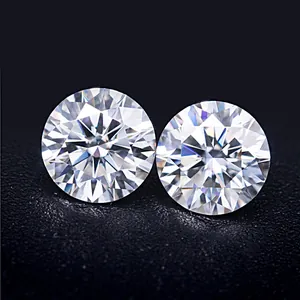 A detailed macro view showing the brilliant fire and facets of two G color round Moissanites.