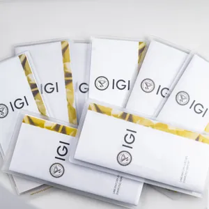 Numerosi rapporti IGI per diamanti coltivati su sfondo bianco