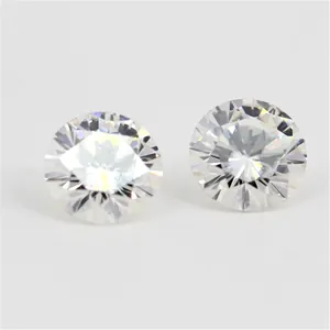 Close-up macro view of two brilliant round cut H color Moissanite loose gemstones
