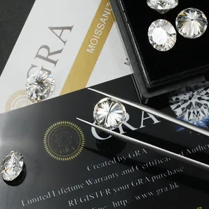 Detailed view of D color VVS moissanite loose stones with GRA certification card and tweezers