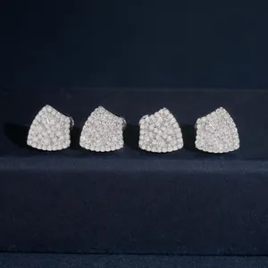 Macro detail of shield-shaped S925 silver earrings pavé set with sparkling moissanite
