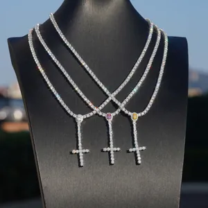 Close-up of 3mm moissanite tennis necklaces with colorful cross pendants in silver
