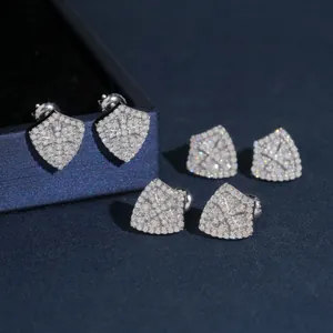 Detailed macro view of S925 silver shield-shaped stud earrings with full moissanite pave