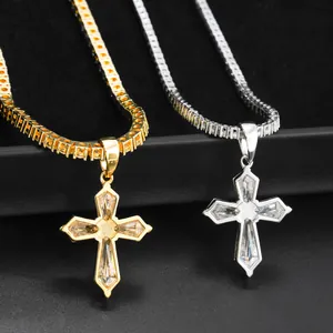 Detailed macro shot of silver and gold moissanite cross pendants on tennis chains.