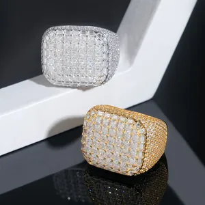 Close-up of gold and silver iced-out square hip-hop rings with Moissanite stones