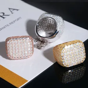 Detailed view of luxury hip hop moissanite rings with iced out pavé setting