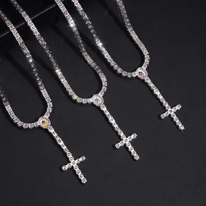 Close-up of three 925 silver moissanite cross tennis necklaces in various colors.