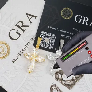 Close-up of S925 silver moissanite cross pendants being tested with a diamond selector.