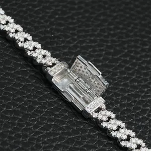 Detailed view of the box clasp on a 6mm single-row iced out Moissanite Cuban chain in S925 silver.