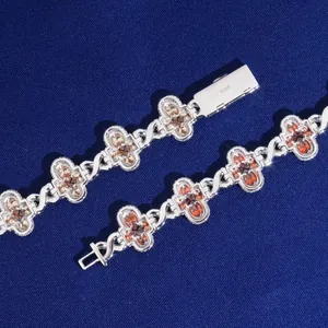 Macro detail of S925 sterling silver hip-hop cross bracelet with champagne moissanite
