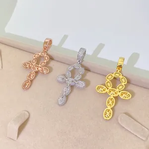 Detailed macro view of three S925 silver hip-hop cross pendants in gold, rose gold and silver
