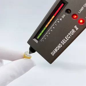 Pear-cut moissanite stud earring being tested by a professional diamond selector II device