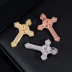 Close-up of three moissanite hip hop cross pendants in gold, rose gold, and silver S925