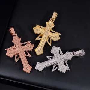 Detail of three S925 silver Moissanite hip hop cross pendants in gold and silver finishes