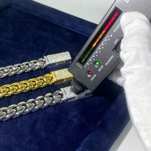 Close-up detail of moissanite testing on a 14mm stainless steel Cuban link chain buckle