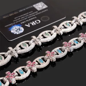 Macro view of S925 silver hip hop bracelet with colorful moissanite and cross elements.