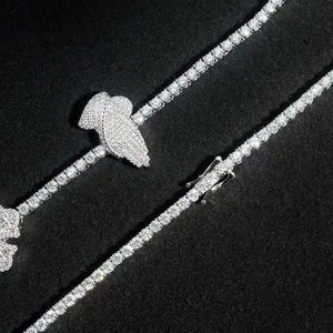 Close-up of hip-hop moissanite tennis chain with a shimmering praying hands pendant