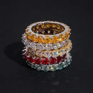 Stacked colorful 4mm moissanite eternity rings in S925 sterling silver settings.