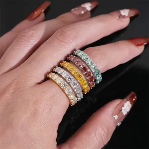 Close-up of S925 silver eternity rings set with 4mm colorful Moissanite stones