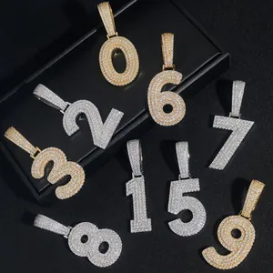 Detailed view of hip-hop 0-9 number pendants with sparkly moissanite in gold and silver